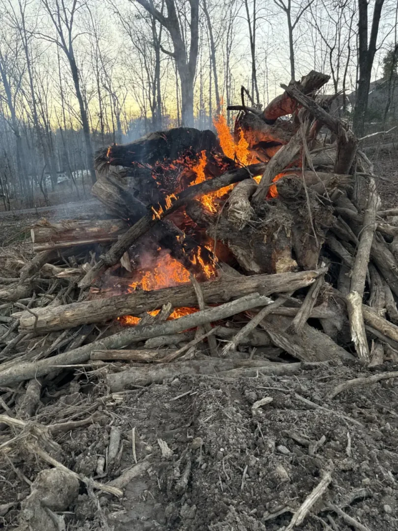 Land Clearing: a large brush and stump burn pile on a land clearing job near Birchwood, TN